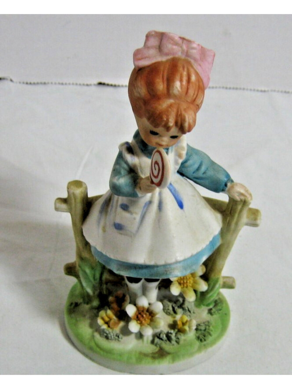 RaRe LEFTON Girl Fence EATING a LOLLIPOP Flowers Figurine
